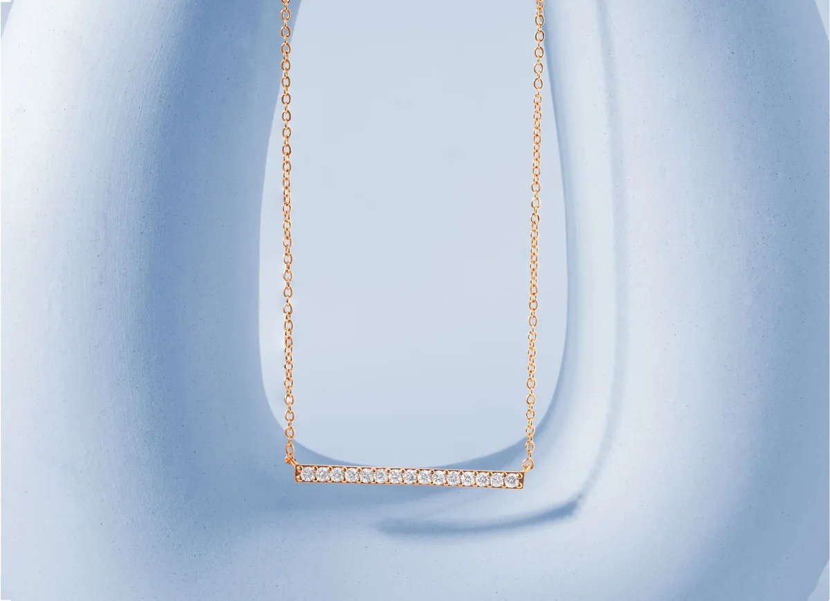 The gold bar necklace: a minimalist classic, and its bullion cousin